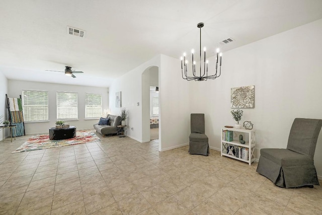20209 Harrier Flight Trl, Pflugerville, TX 78660 - living area with arched walkways, a chandelier, and a ceiling fan