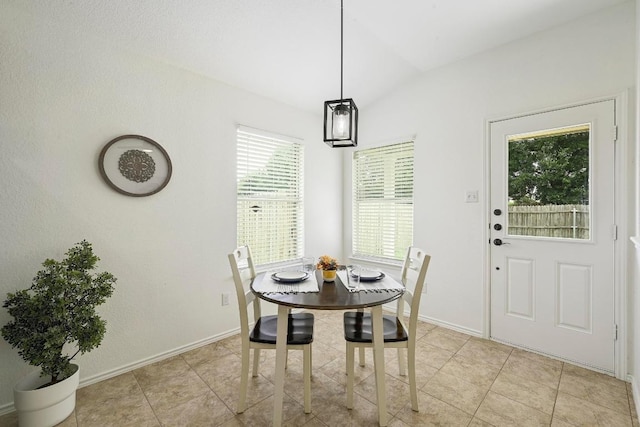 20209 Harrier Flight Trl, Pflugerville, TX 78660 - dining space with vaulted ceiling and light tile patterned flooring
