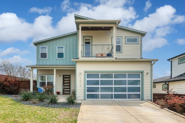 7013 Boyle Dr, Austin, TX 78724 - view of front of house with a balcony, concrete driveway, a garage, board and batten siding, and a porch