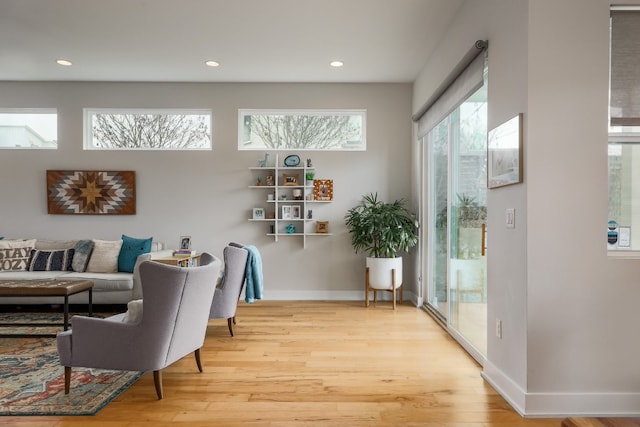 7013 Boyle Dr, Austin, TX 78724 - sitting room featuring wood finished floors and recessed lighting