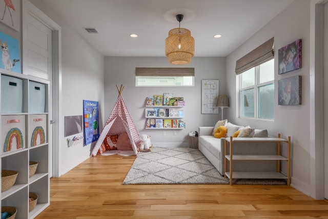 7013 Boyle Dr, Austin, TX 78724 - playroom featuring wood finished floors and recessed lighting