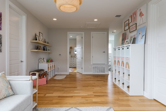 7013 Boyle Dr, Austin, TX 78724 - corridor with light wood-style floors, recessed lighting, and attic access