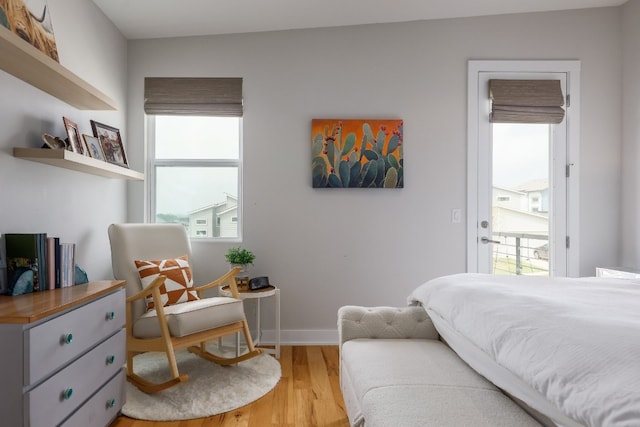7013 Boyle Dr, Austin, TX 78724 - bedroom with multiple windows and wood finished floors