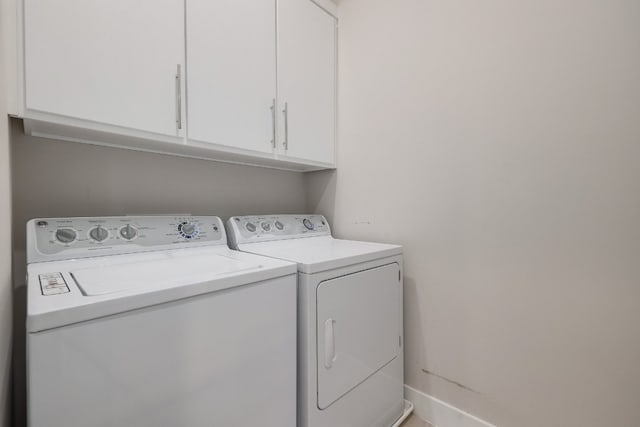 7013 Boyle Dr, Austin, TX 78724 - laundry area featuring washer and clothes dryer and cabinet space