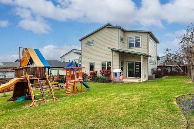 7013 Boyle Dr, Austin, TX 78724 - rear view of house featuring a playground