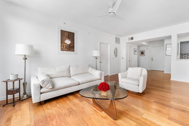 54 Rainey St Unit 1018, Austin, TX 78701 - living room featuring light wood finished floors and a ceiling fan
