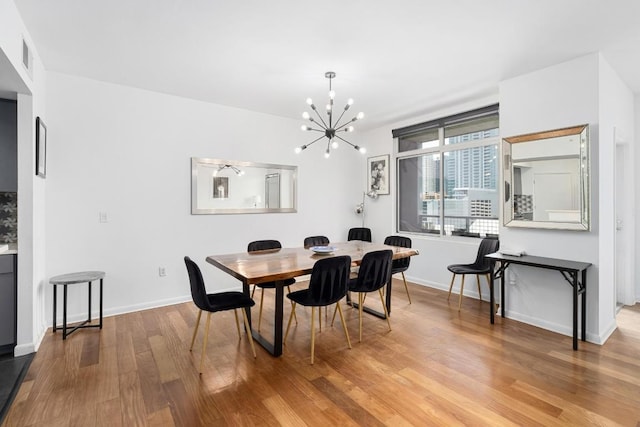 54 Rainey St Unit 1018, Austin, TX 78701 - dining room with a chandelier and wood finished floors