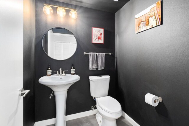 54 Rainey St Unit 1018, Austin, TX 78701 - bathroom with toilet and wood finished floors