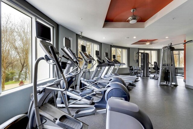 54 Rainey St Unit 1018, Austin, TX 78701 - workout area with recessed lighting and a tray ceiling