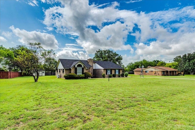 206 Live Oak Dr, Mountain City, TX 78610 - view of front of house featuring a storage shed