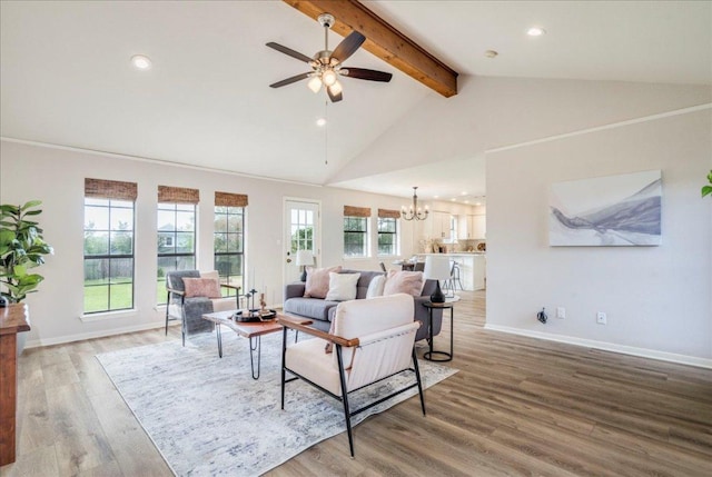 206 Live Oak Dr, Mountain City, TX 78610 - living room featuring beam ceiling, a chandelier, ceiling fan, wood finished floors, and recessed lighting