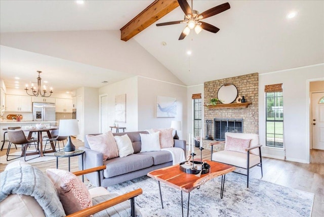 206 Live Oak Dr, Mountain City, TX 78610 - living area with beam ceiling, light wood-style flooring, a ceiling fan, recessed lighting, and a chandelier