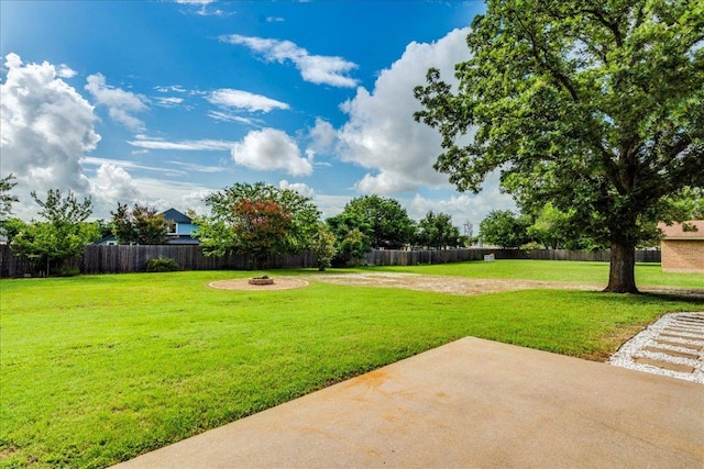 206 Live Oak Dr, Mountain City, TX 78610 - fenced backyard featuring a patio and an outdoor fire pit