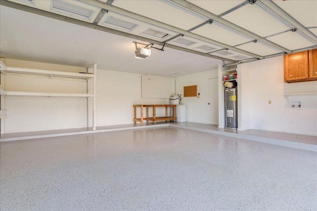 206 Live Oak Dr, Mountain City, TX 78610 - garage with water heater and a garage door opener