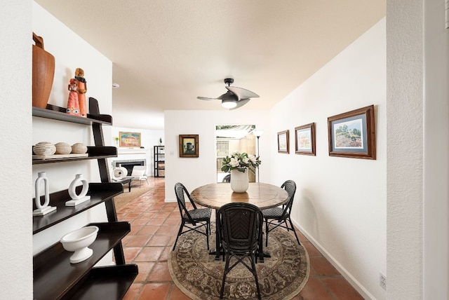 3617 Las Colinas Dr Unit B, Austin, TX 78731 - dining room with a ceiling fan, light tile patterned floors, and a fireplace