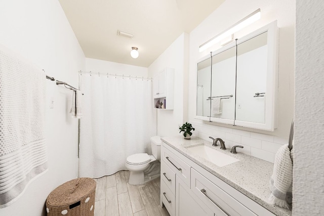 3617 Las Colinas Dr Unit B, Austin, TX 78731 - bathroom with decorative backsplash, vanity, wood finished floors, and a shower with curtain