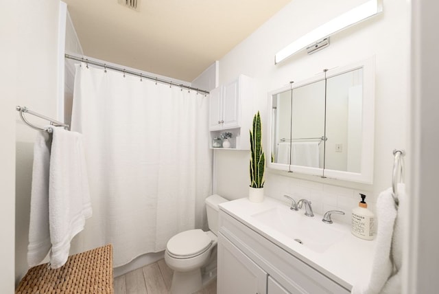 3617 Las Colinas Dr Unit B, Austin, TX 78731 - bathroom with vanity, decorative backsplash, wood finished floors, and a shower with shower curtain
