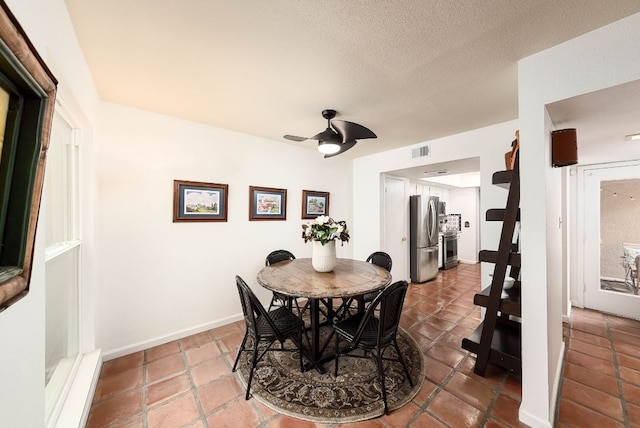 3617 Las Colinas Dr Unit B, Austin, TX 78731 - tiled dining area featuring a ceiling fan and a textured ceiling