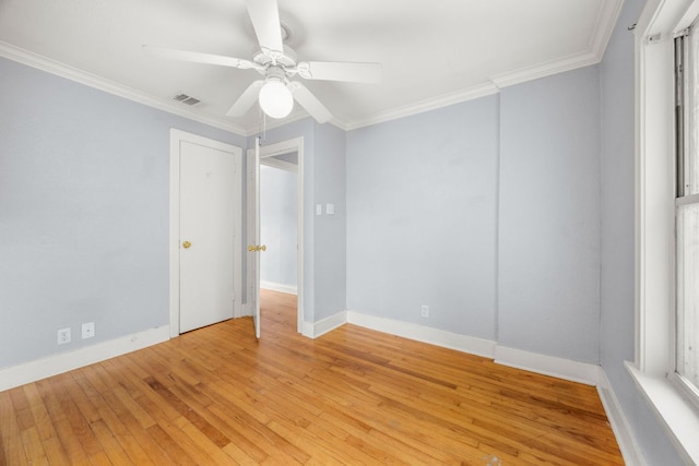 5513 Jim Hogg Ave, Austin, TX 78756 - spare room featuring ornamental molding, light wood-style flooring, and ceiling fan