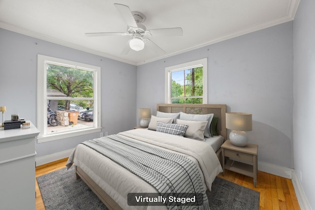 5513 Jim Hogg Ave, Austin, TX 78756 - bedroom with ornamental molding, light wood-type flooring, and ceiling fan