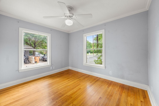 5513 Jim Hogg Ave, Austin, TX 78756 - unfurnished room featuring plenty of natural light, light wood-type flooring, crown molding, and ceiling fan