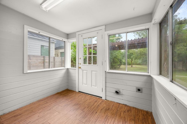 5513 Jim Hogg Ave, Austin, TX 78756 - unfurnished sunroom with wood finished floors and wood walls