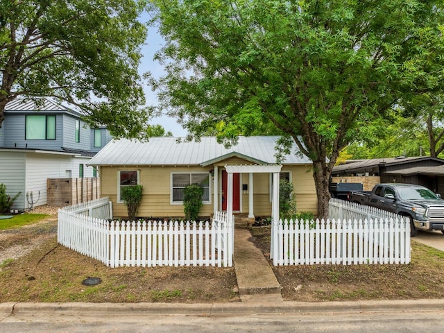 5513 Jim Hogg Ave, Austin, TX 78756 - bungalow with a metal roof and a fenced front yard