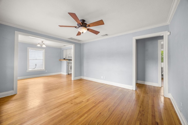 5513 Jim Hogg Ave, Austin, TX 78756 - unfurnished living room featuring light wood finished floors, a ceiling fan, ornamental molding, and a chandelier