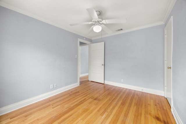 5513 Jim Hogg Ave, Austin, TX 78756 - spare room with light wood finished floors, a ceiling fan, and crown molding