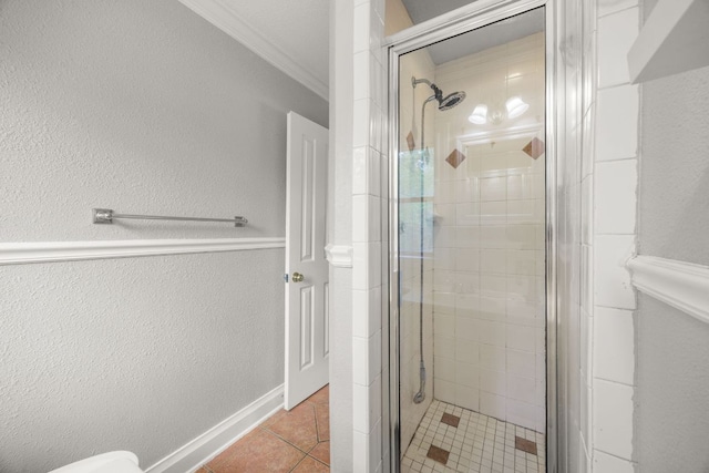 5513 Jim Hogg Ave, Austin, TX 78756 - bathroom with a stall shower, crown molding, tile patterned flooring, and a textured wall