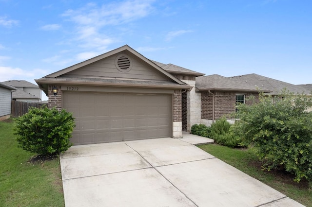 15212 Shell Bark Cv, Austin, TX 78724 - single story home with brick siding, driveway, and an attached garage
