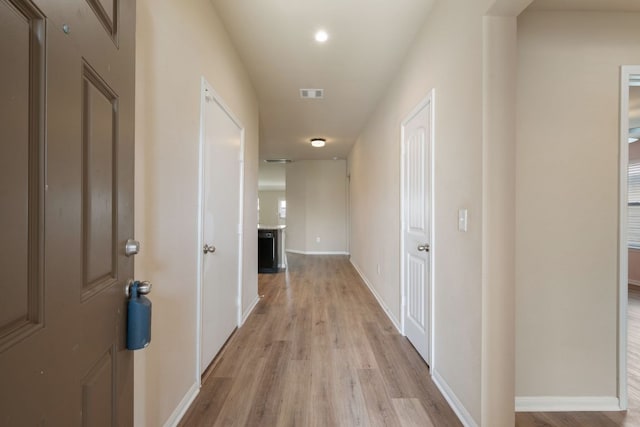 15212 Shell Bark Cv, Austin, TX 78724 - hallway with light wood-style flooring and recessed lighting