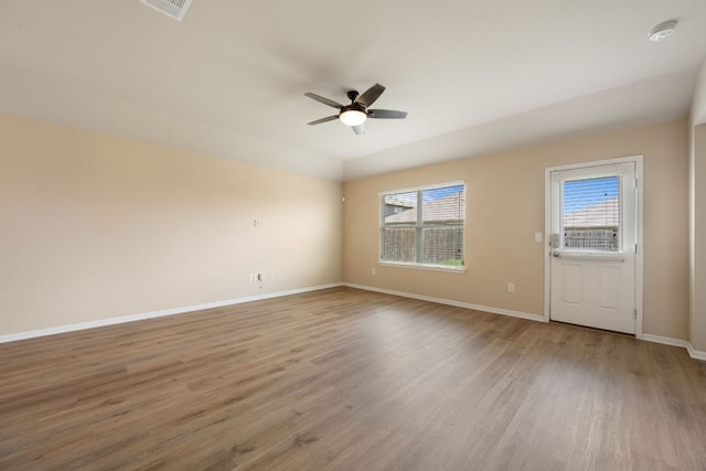 15212 Shell Bark Cv, Austin, TX 78724 - empty room featuring a smoke detector, a ceiling fan, and wood finished floors