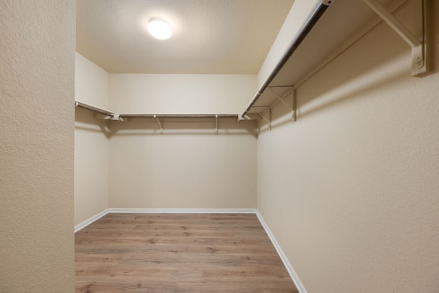 15212 Shell Bark Cv, Austin, TX 78724 - spacious closet featuring wood finished floors