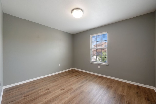 15212 Shell Bark Cv, Austin, TX 78724 - spare room featuring wood finished floors and baseboards