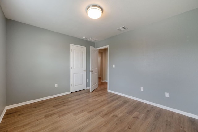 15212 Shell Bark Cv, Austin, TX 78724 - empty room featuring baseboards and light wood-style flooring