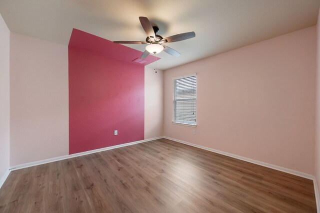 15212 Shell Bark Cv, Austin, TX 78724 - spare room with wood finished floors and a ceiling fan