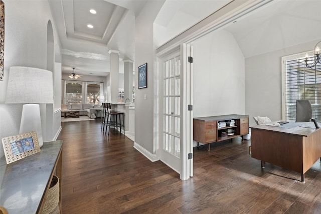 10408 Hansa Dr, Austin, TX 78739 - office with dark wood-style floors, ceiling fan, arched walkways, recessed lighting, and a tray ceiling