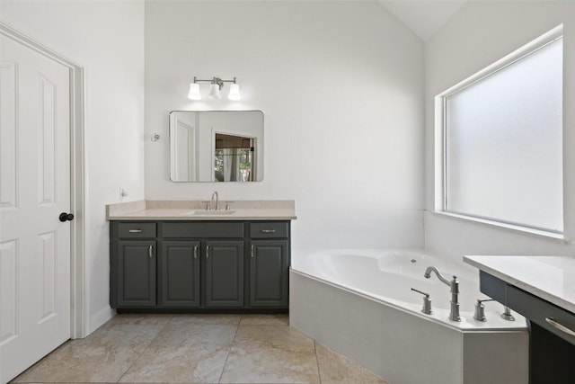 10408 Hansa Dr, Austin, TX 78739 - bathroom featuring vanity, a bath, lofted ceiling, and tile patterned floors