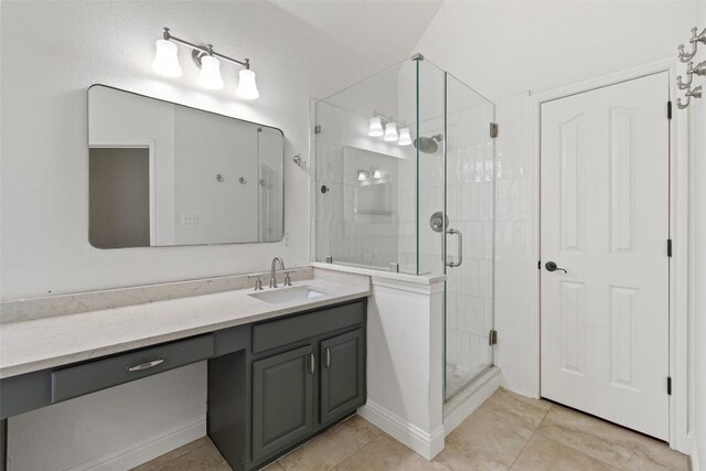 10408 Hansa Dr, Austin, TX 78739 - bathroom featuring vanity, a stall shower, and tile patterned floors