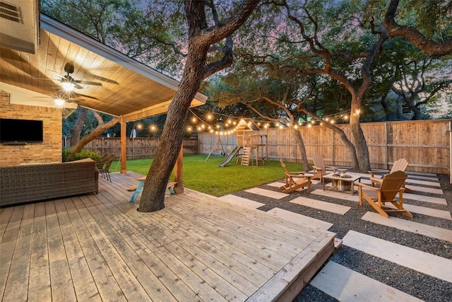 10408 Hansa Dr, Austin, TX 78739 - wooden terrace with a playground, ceiling fan, a fenced backyard, and an outdoor living space with a fire pit