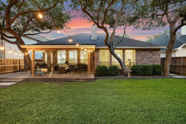 10408 Hansa Dr, Austin, TX 78739 - back of property at dusk featuring a wooden deck, a chimney, brick siding, outdoor lounge area, and a shingled roof