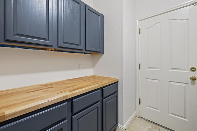 10408 Hansa Dr, Austin, TX 78739 - washroom featuring light tile patterned flooring and baseboards