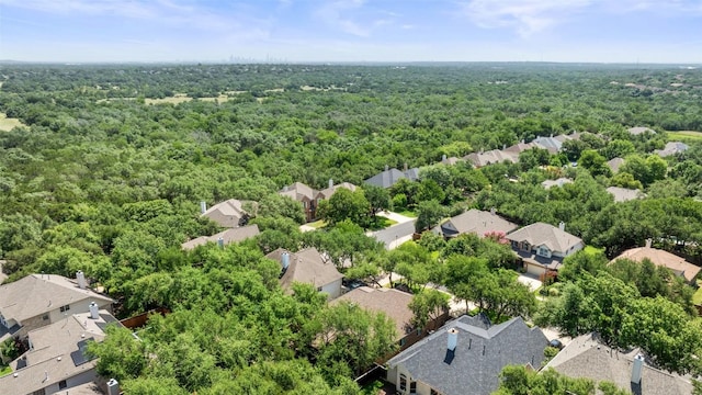 10408 Hansa Dr, Austin, TX 78739 - aerial perspective of suburban area featuring a heavily wooded area