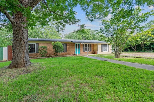 10000 Gail Rd, Austin, TX 78748 - ranch-style house with a front lawn and brick siding