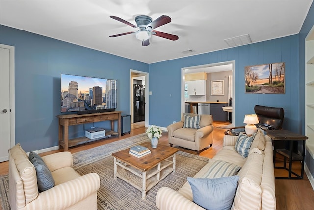 10000 Gail Rd, Austin, TX 78748 - living area with wood finished floors and a ceiling fan