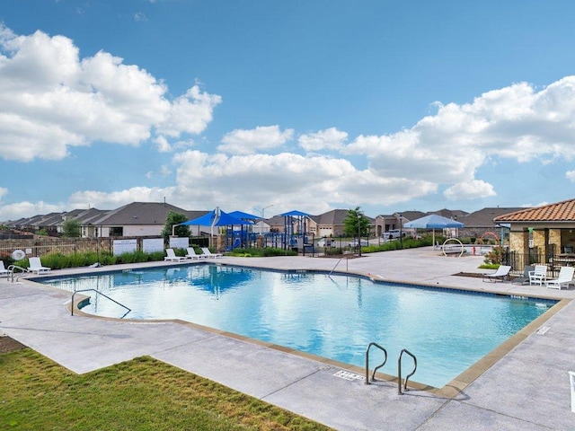 16601 Aventura Ave, Pflugerville, TX 78660 - community pool with a residential view and a patio area