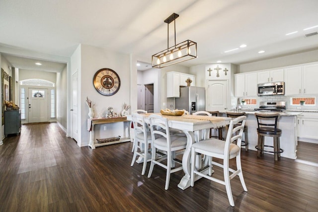 16601 Aventura Ave, Pflugerville, TX 78660 - dining area featuring dark wood-type flooring and recessed lighting