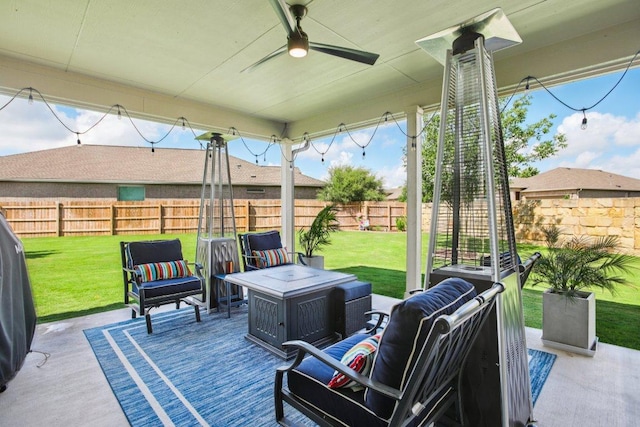 16601 Aventura Ave, Pflugerville, TX 78660 - fenced backyard featuring ceiling fan, an outdoor hangout area, and a patio