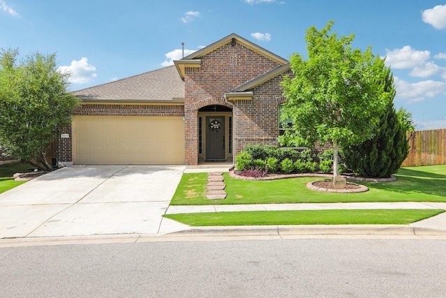 16601 Aventura Ave, Pflugerville, TX 78660 - view of front facade with brick siding, a garage, and concrete driveway
